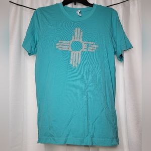 Teal Bella Canvas shirt with reflective New Mexico symbol